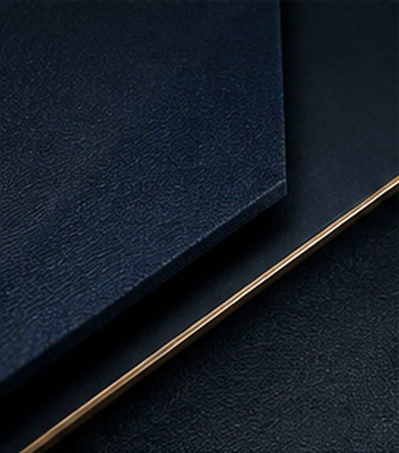 Deep navy textured surface with a fine brass line